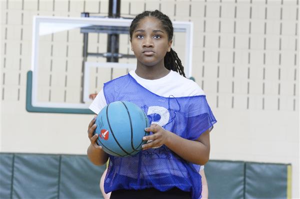 Student Shooting a Free Throw in a Basketball Game